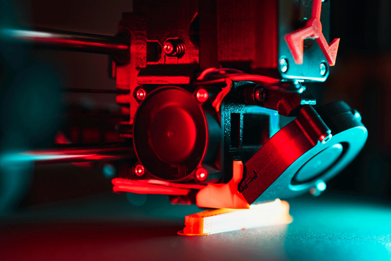 Close up of a 3D printer head printing